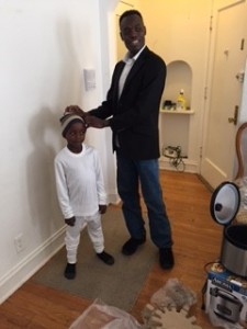 Ahmed Ahmed with one of the children who received DOHS donations.